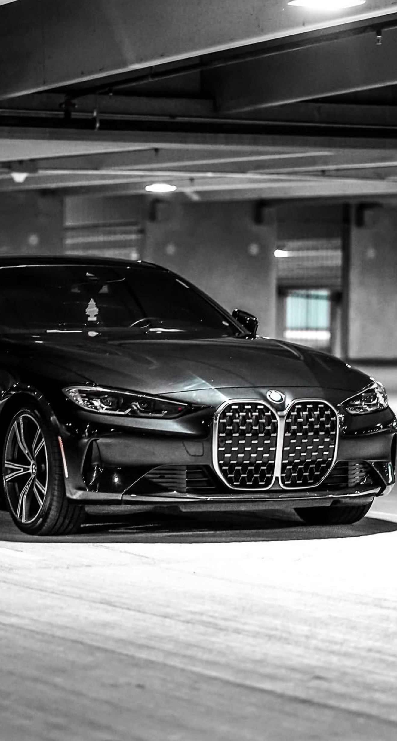 BMW parked in a garage, automotive lifestyle shot